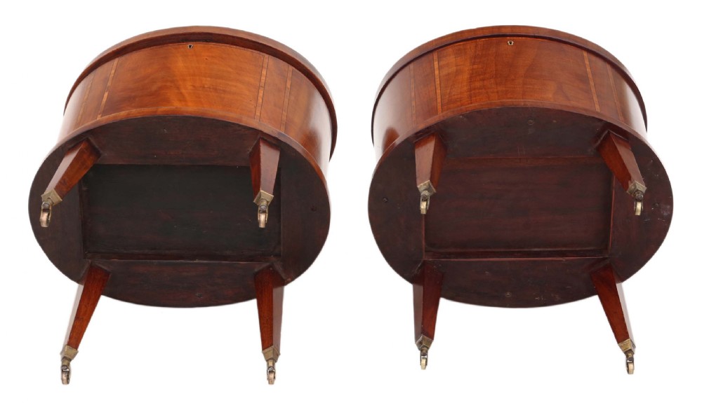 A pair of 19th-century oval mahogany cellarettes with line inlay, escutcheons, tapered legs, and brass castors. View VIII