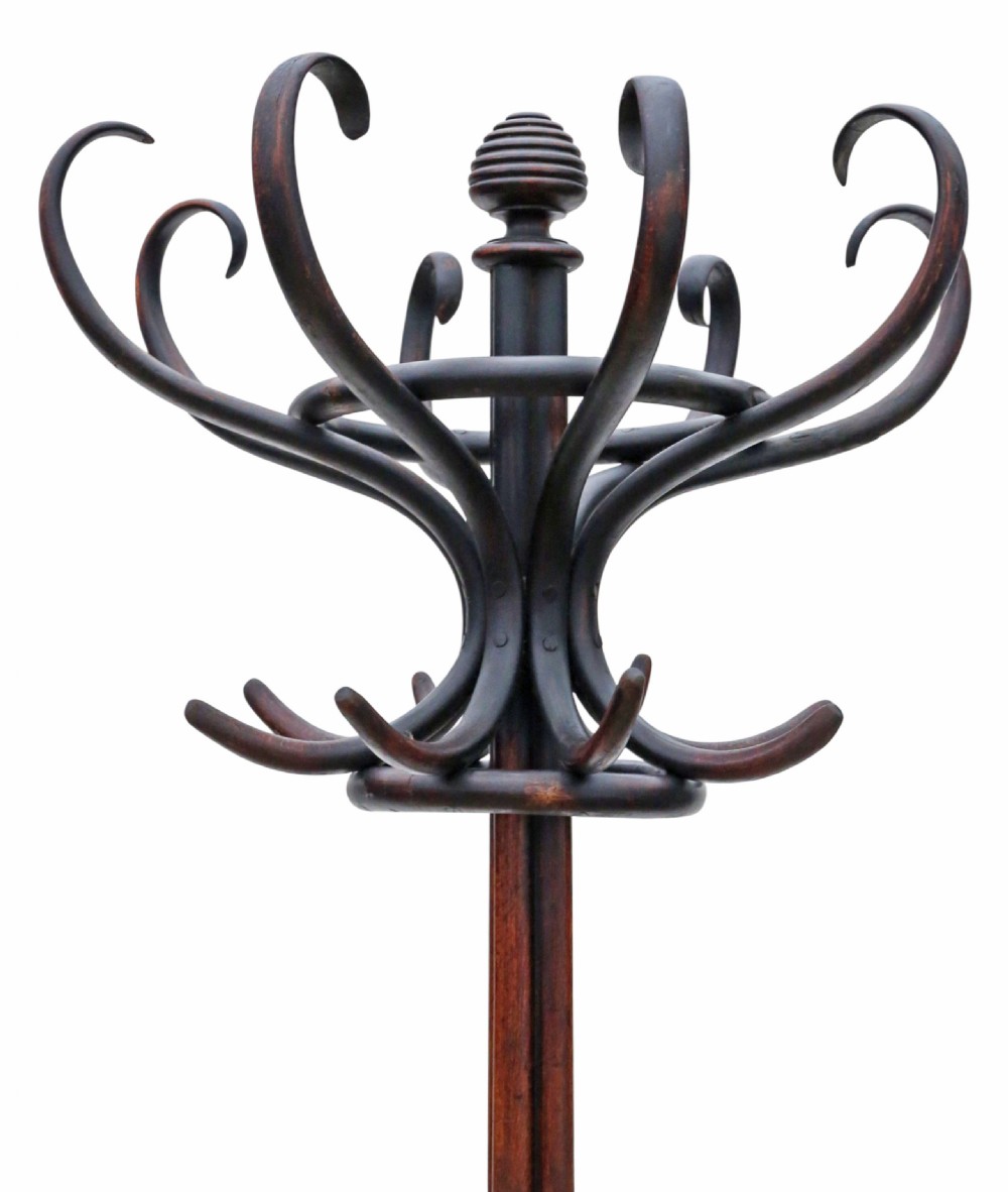 A dark brown bentwood hall stand featuring a central column, upper curved hat hooks, lower coat pegs, scrolled base supports, and four splayed feet. View IV