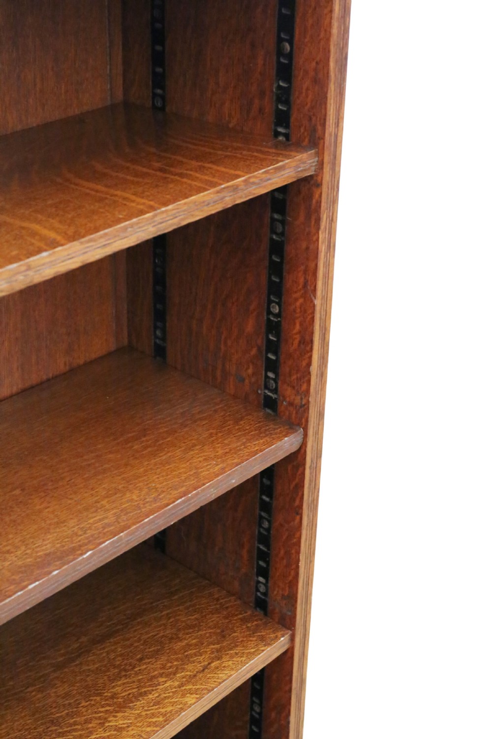 A 19th-century medium oak open bookcase featuring gothic shaped sides with cutout motifs and adjustable internal shelves. View IV