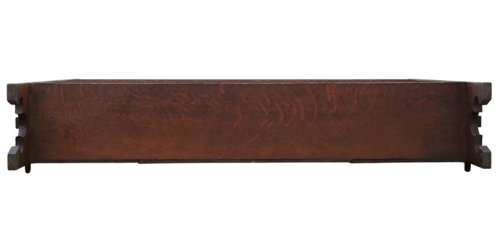 A 19th-century medium oak open bookcase featuring gothic shaped sides with cutout motifs and adjustable internal shelves. View VII