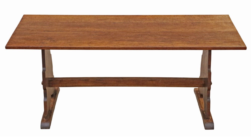 An antique late 19th-century solid oak Arts and Crafts refectory dining table featuring shaped trestle ends and a tusked tenon stretcher. View VIII