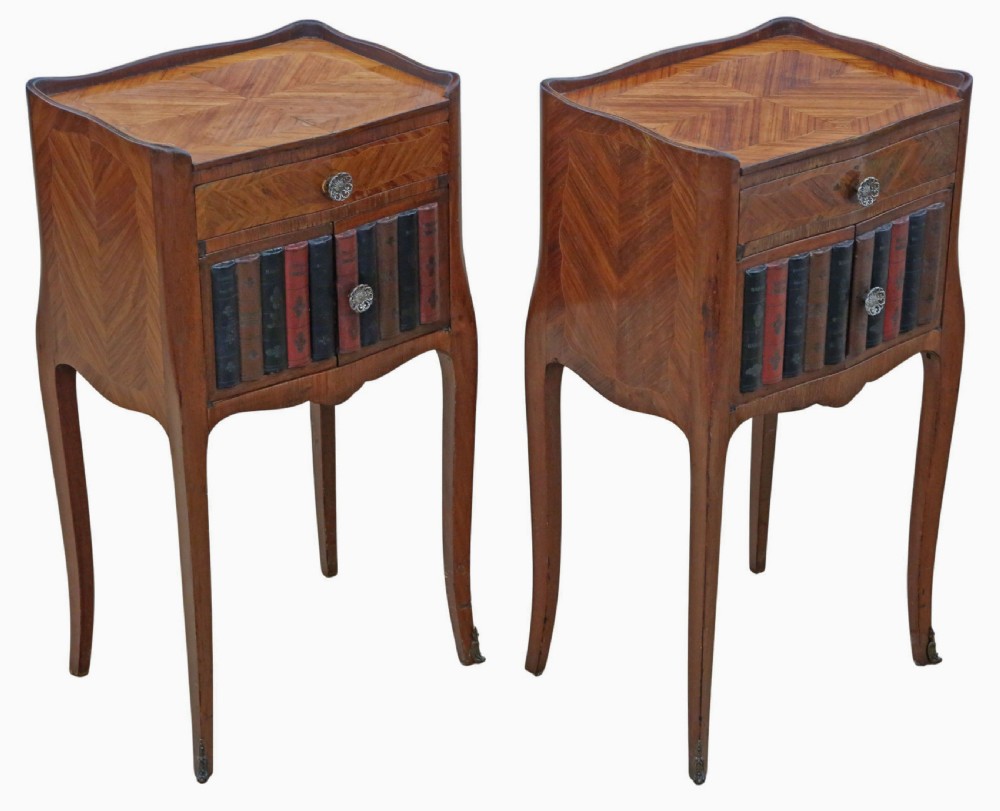 A pair of French parquetry bedside tables featuring slender cabriole legs, a single top drawer, and a lower cabinet concealed by faux leather book spines. View II