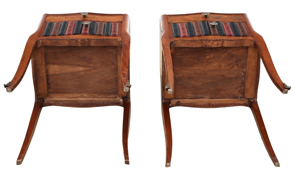 A pair of French parquetry bedside tables featuring slender cabriole legs, a single top drawer, and a lower cabinet concealed by faux leather book spines. View VIII