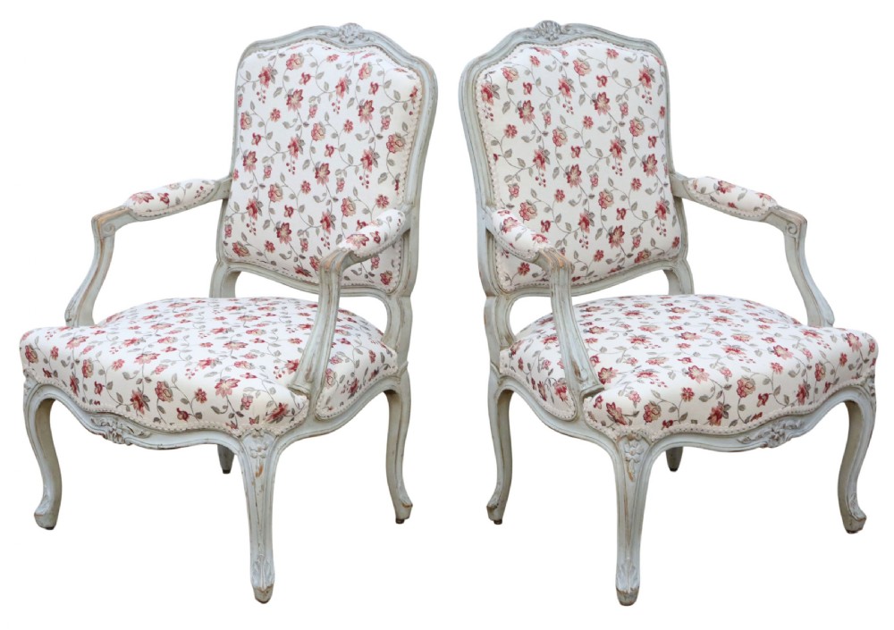 A pair of antique French Louis XV style open armchairs with carved light grey painted frames and floral print upholstery. View III