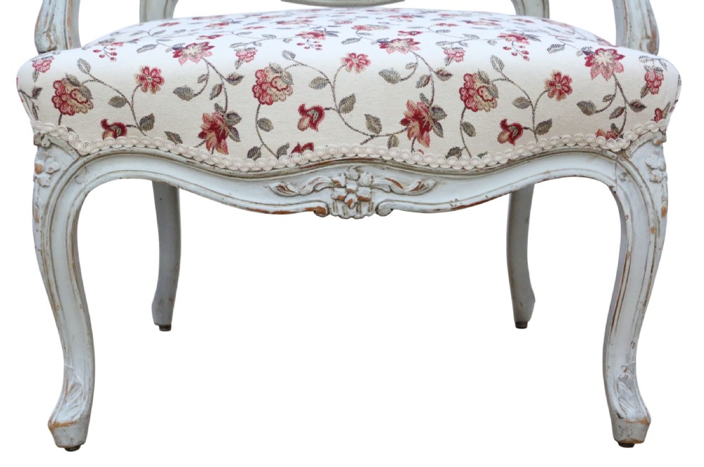 A pair of antique French Louis XV style open armchairs with carved light grey painted frames and floral print upholstery. View VII