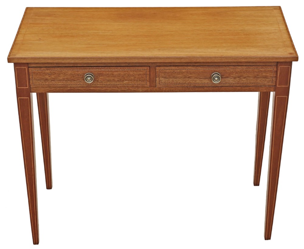 An Edwardian red walnut writing table with two drawers, decorative string inlay, brass ring handles, and tapered square legs. View II