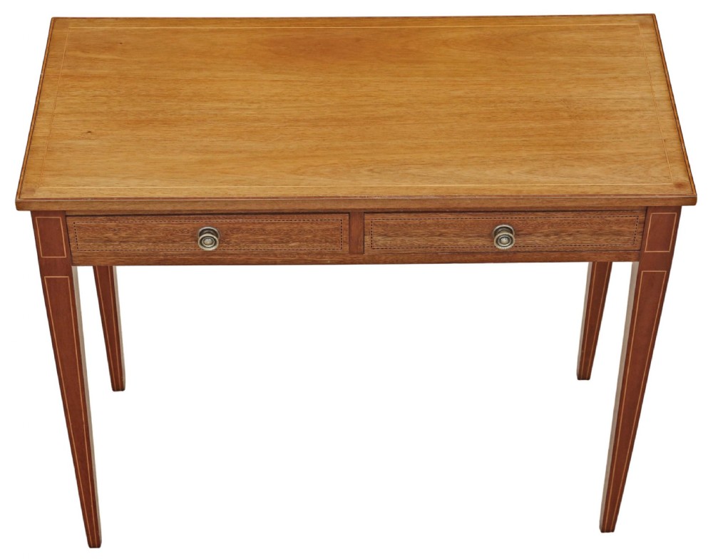 An Edwardian red walnut writing table with two drawers, decorative string inlay, brass ring handles, and tapered square legs. View III