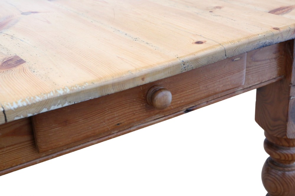 A 19th-century pine kitchen table featuring turned legs, a rectangular plank top, and an end drawer with a turned wood knob. View III