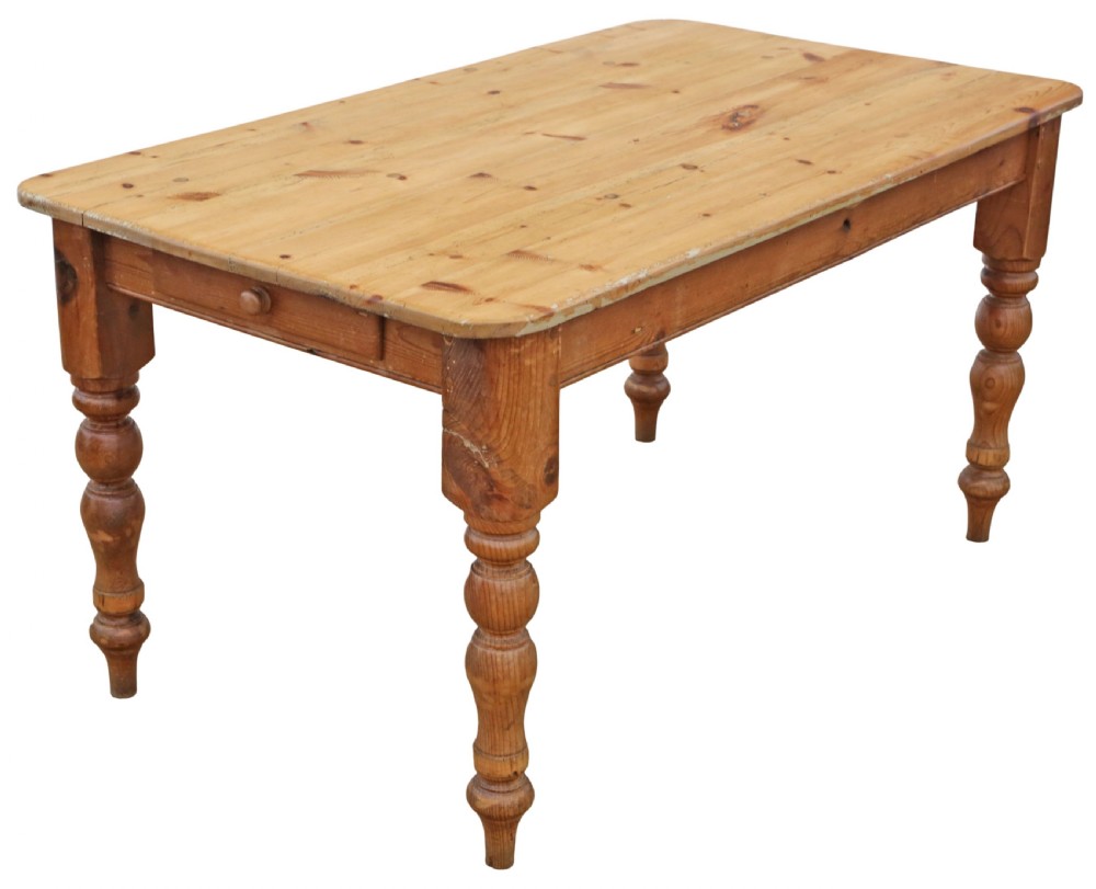 A 19th-century pine kitchen table featuring turned legs, a rectangular plank top, and an end drawer with a turned wood knob. View VII