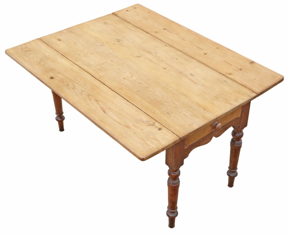 A 19th-century Victorian pine drop-leaf kitchen table featuring turned fruitwood legs, a single end drawer with a wooden knob, and a warm natural finish. View II