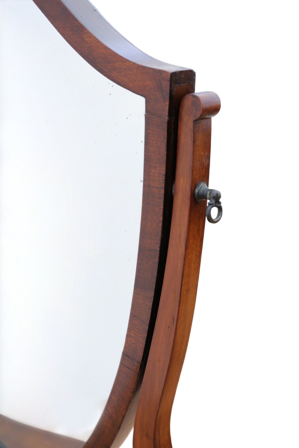 A 19th-century mahogany dressing table mirror featuring an arched shield-shaped glass frame supported by curved uprights above a serpentine base with three small drawers. View III