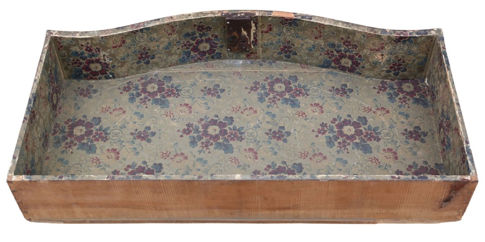 An 18th-century Continental oak and walnut chest of drawers featuring a serpentine front, crossbanded top, and three drawers with ornamental brass handles. View VI