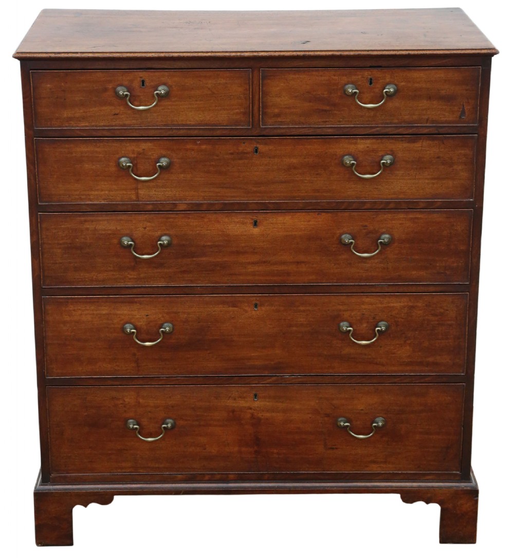 A late 18th-century Georgian mahogany chest of drawers featuring two short over three long graduated drawers with brass handles and bracket feet. View III