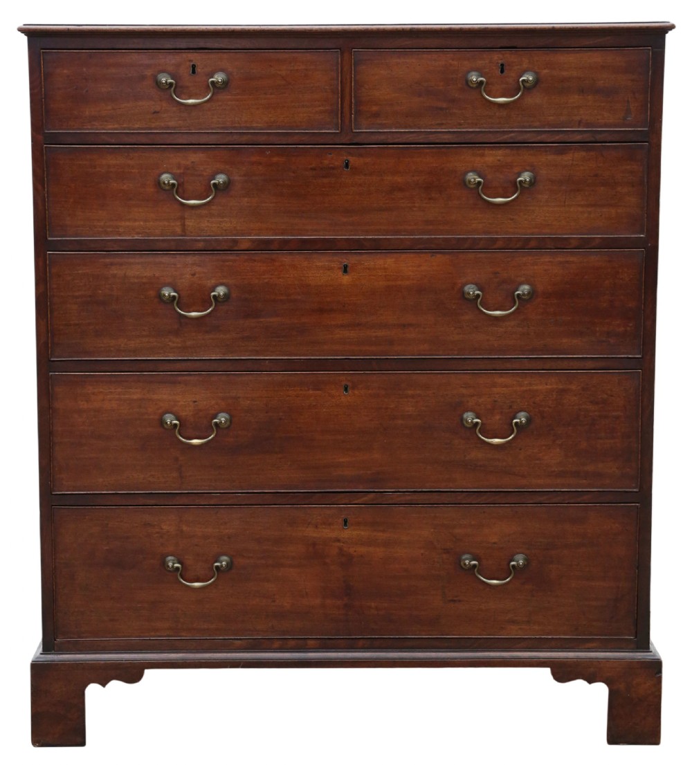 A late 18th-century Georgian mahogany chest of drawers featuring two short over three long graduated drawers with brass handles and bracket feet. View V