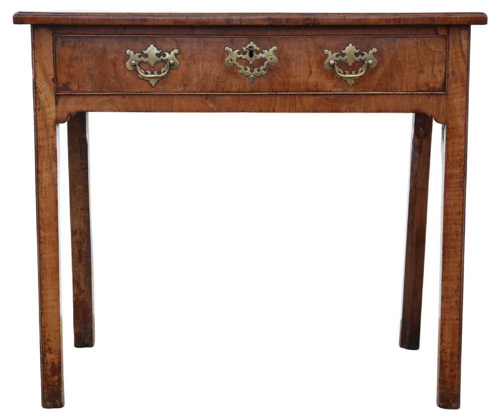 An 18th-century Georgian walnut writing table featuring a quarter-veneered top, single drawer with brass drop handles, and straight square legs. View VI