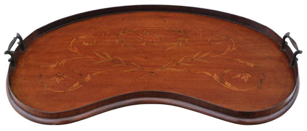 A kidney-shaped mahogany serving tray featuring floral marquetry inlay, a raised gallery, and twin brass handles.
