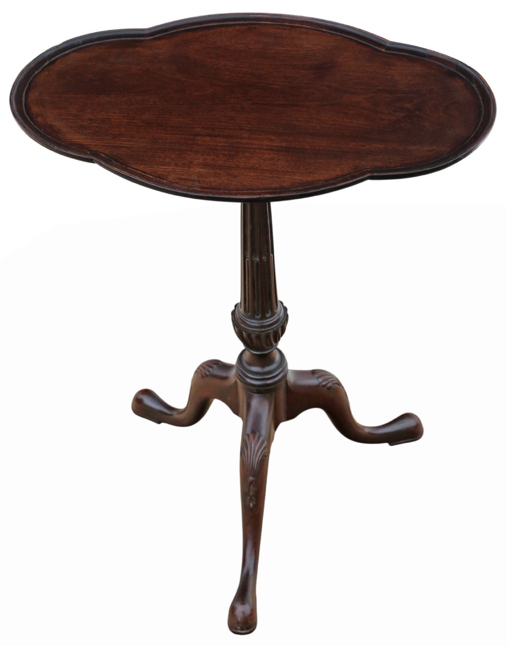 A dark mahogany tripod wine table featuring a scalloped shaped top, a fluted column stem, and three carved legs. View V