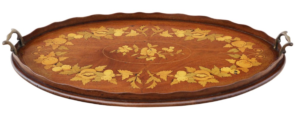 An oval mahogany serving tray featuring detailed floral marquetry inlay, a scalloped rim, and two cast brass handles. View IV