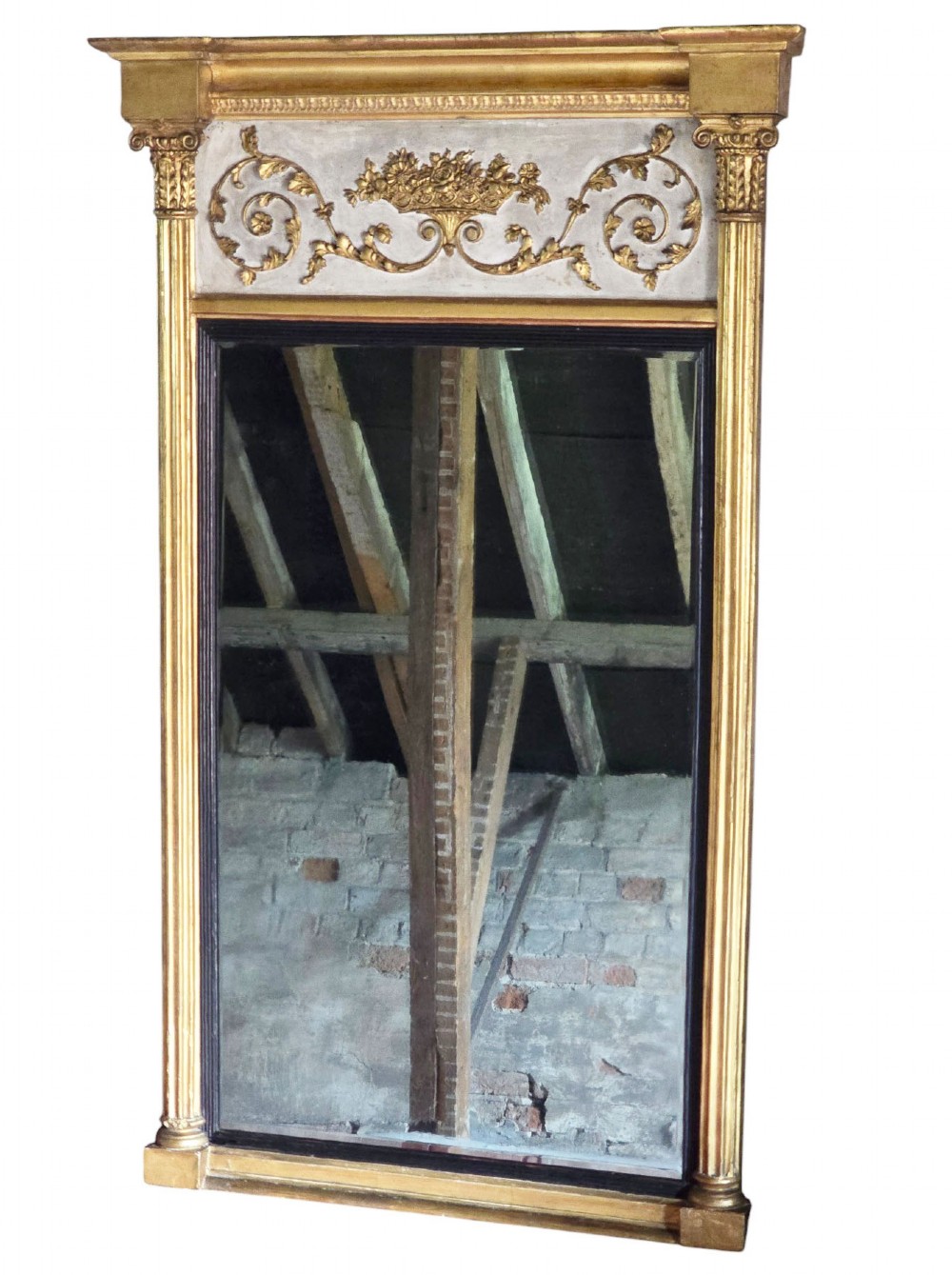 A tall 19th-century neoclassical overmantel pier mirror featuring a gilt frame, fluted side pilasters, and an upper floral frieze panel. View II