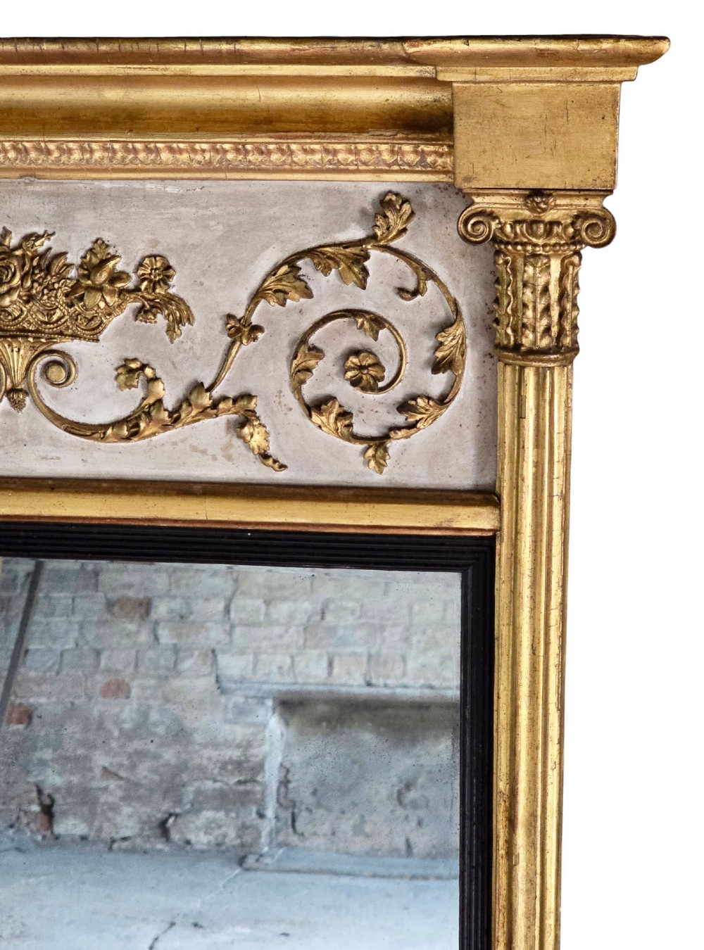 A tall 19th-century neoclassical overmantel pier mirror featuring a gilt frame, fluted side pilasters, and an upper floral frieze panel. View III