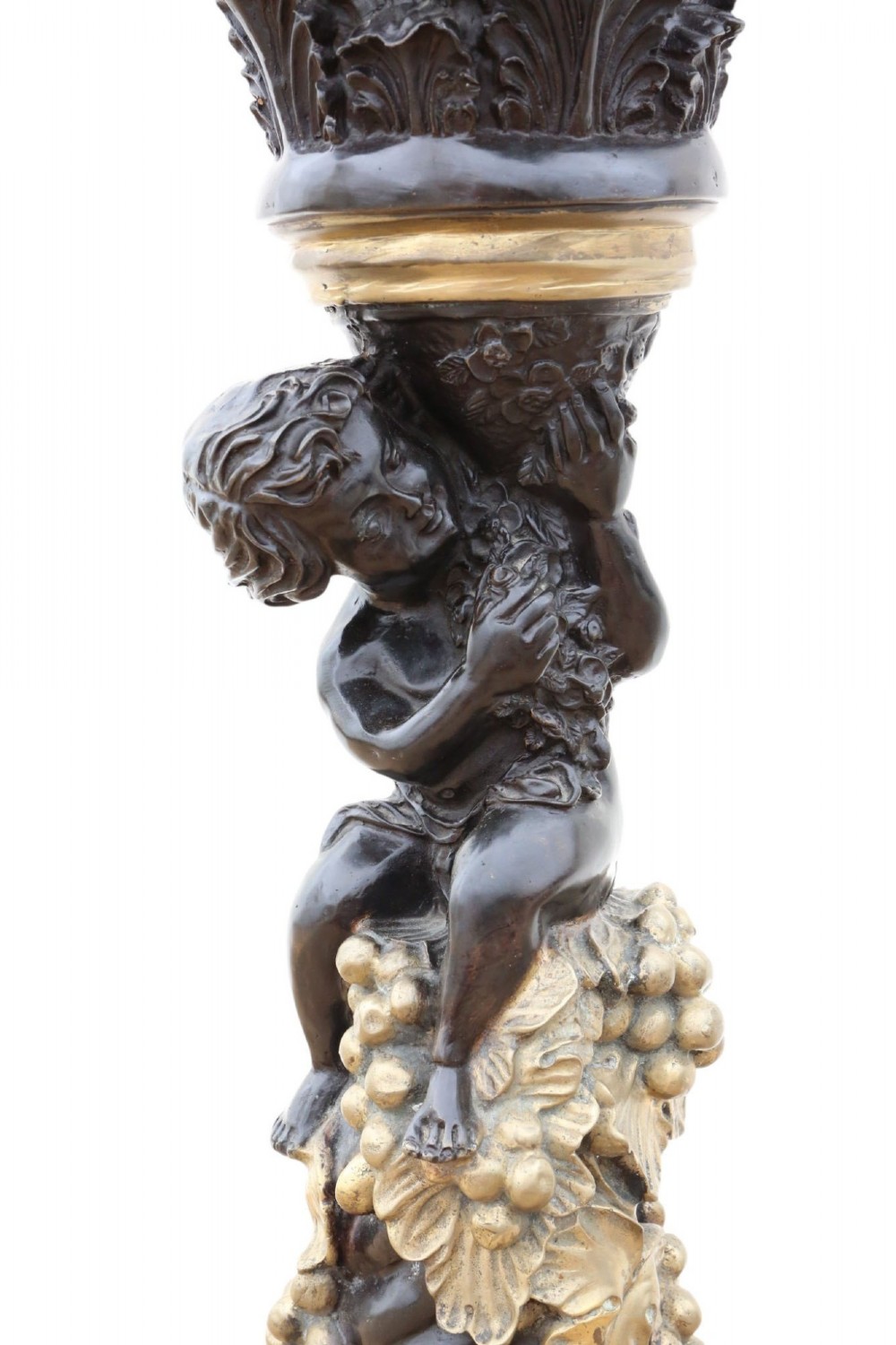 A French dark bronze and gilt pedestal stand featuring an acanthus-carved capital top, a central putto among gilded grapevines, and a stepped circular base. View II
