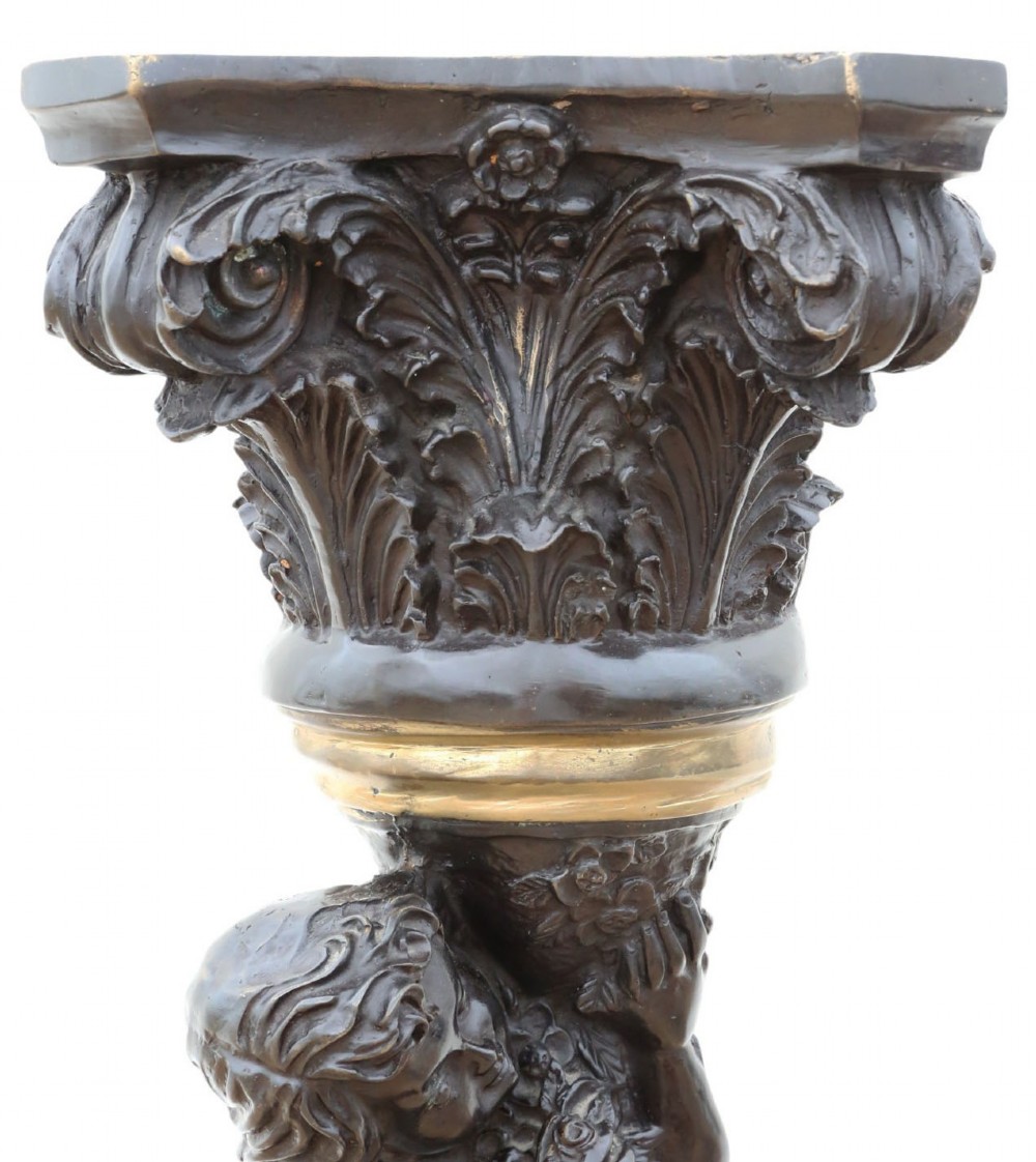 A French dark bronze and gilt pedestal stand featuring an acanthus-carved capital top, a central putto among gilded grapevines, and a stepped circular base. View III