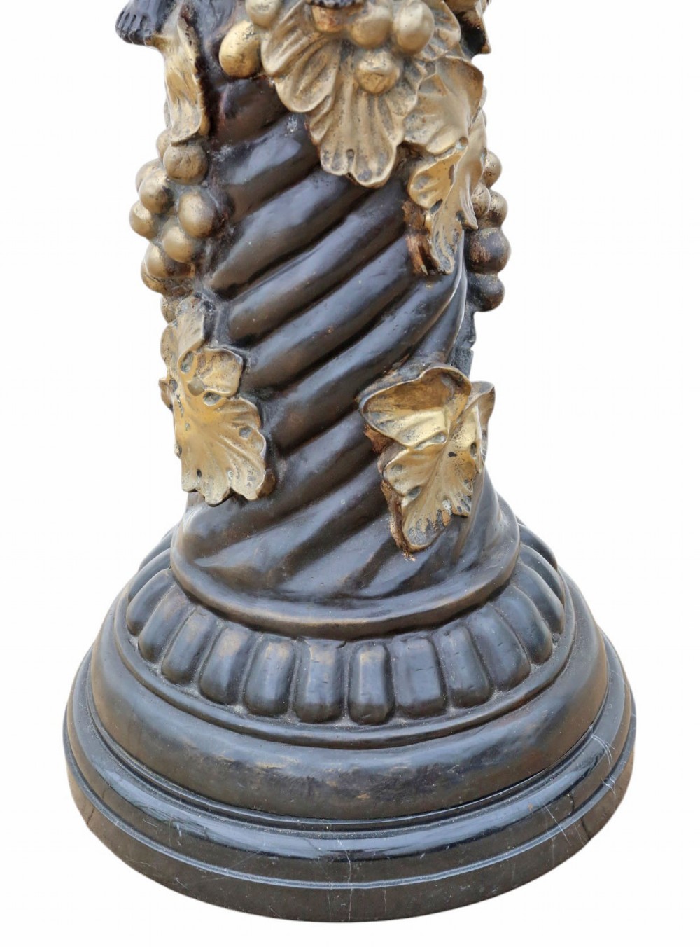 A French dark bronze and gilt pedestal stand featuring an acanthus-carved capital top, a central putto among gilded grapevines, and a stepped circular base. View IV