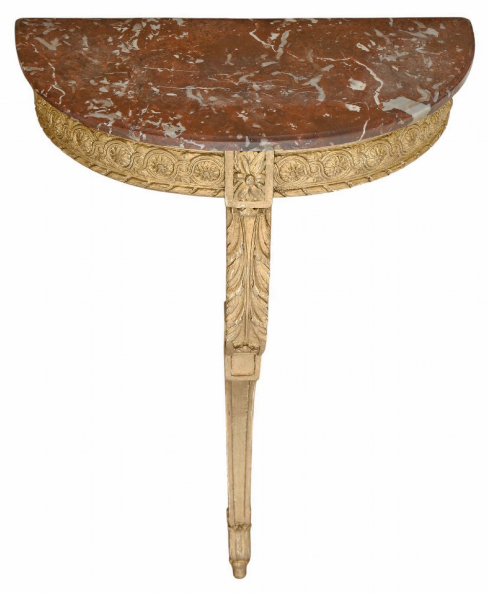A wall-mounted semi-circular console table featuring a red marble top above a carved gold gilt support leg.