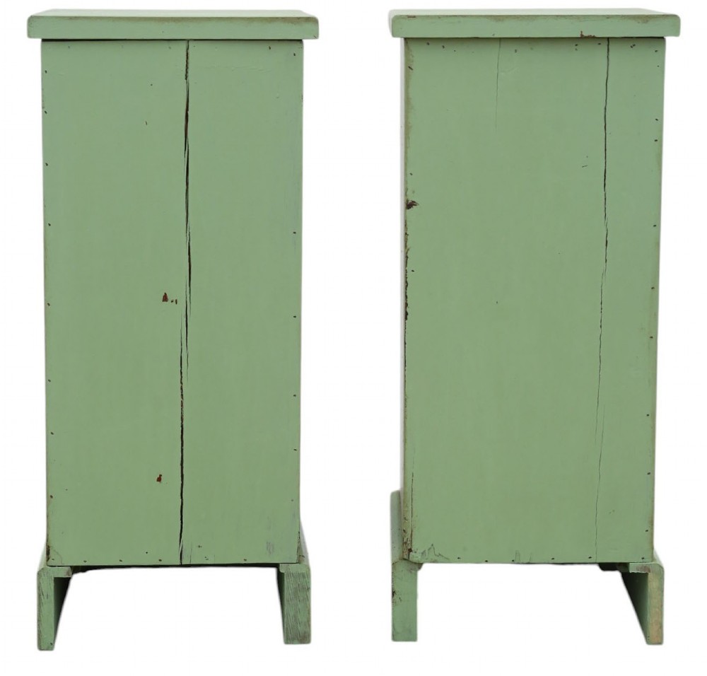 A pair of matching narrow green-painted wooden bedside cabinets, each featuring three drawers with brass shell cup handles and a solid plinth base. View VII