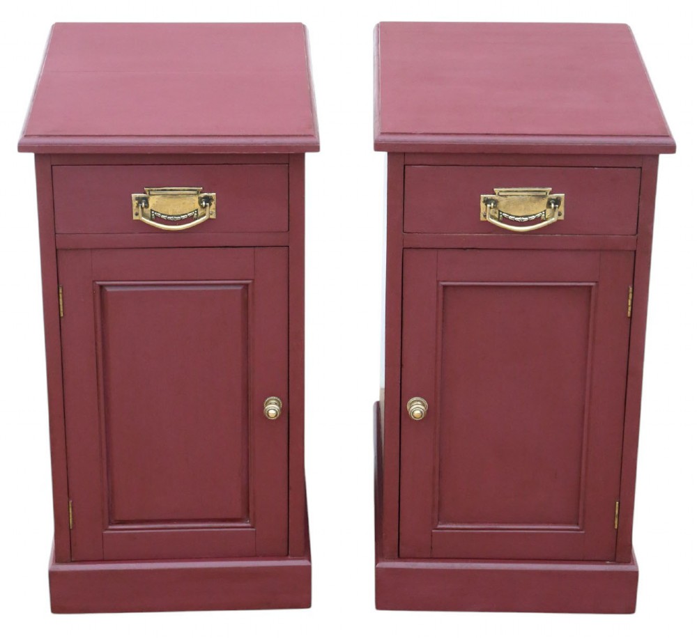 A pair of deep red painted bedside cupboards featuring top drawers with brass handles and panelled single-door cabinets below. View II