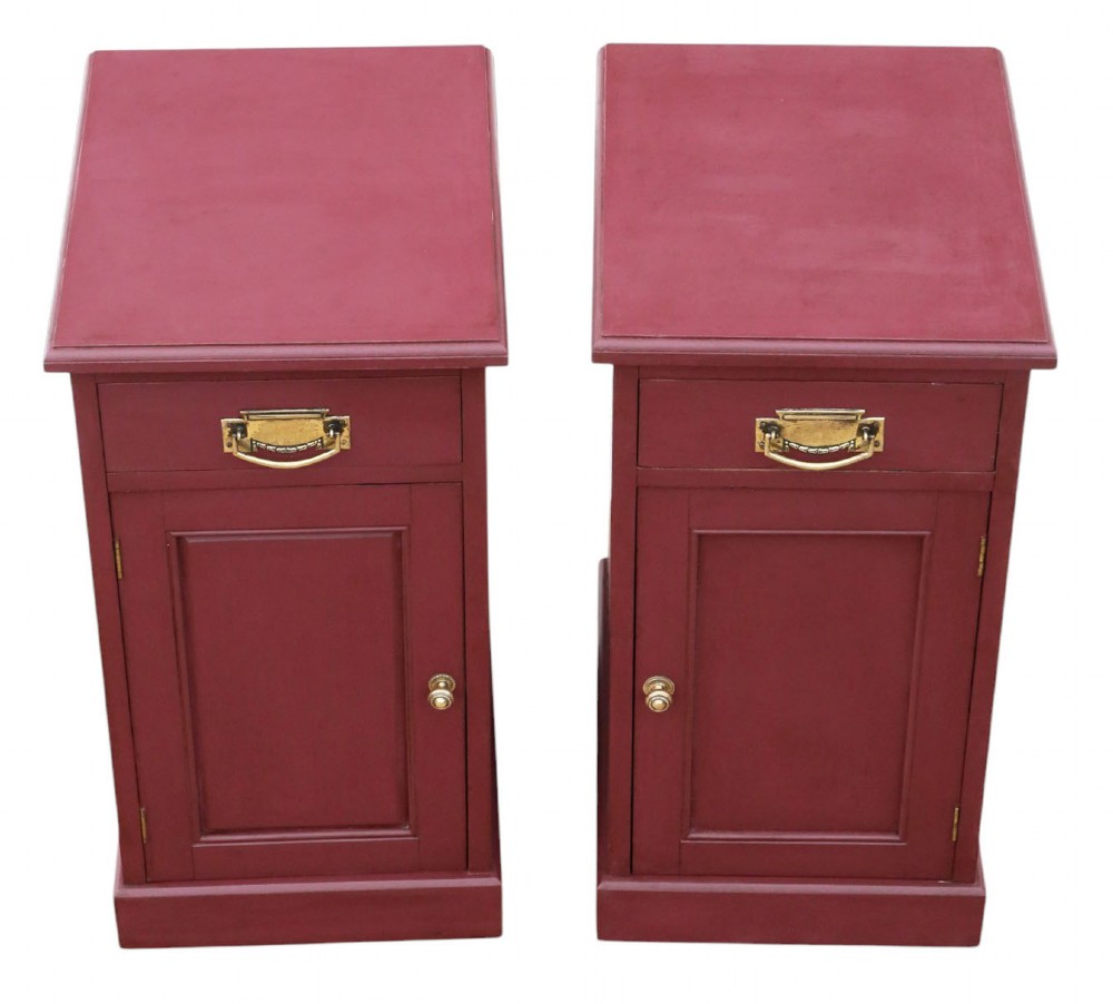 A pair of deep red painted bedside cupboards featuring top drawers with brass handles and panelled single-door cabinets below. View III