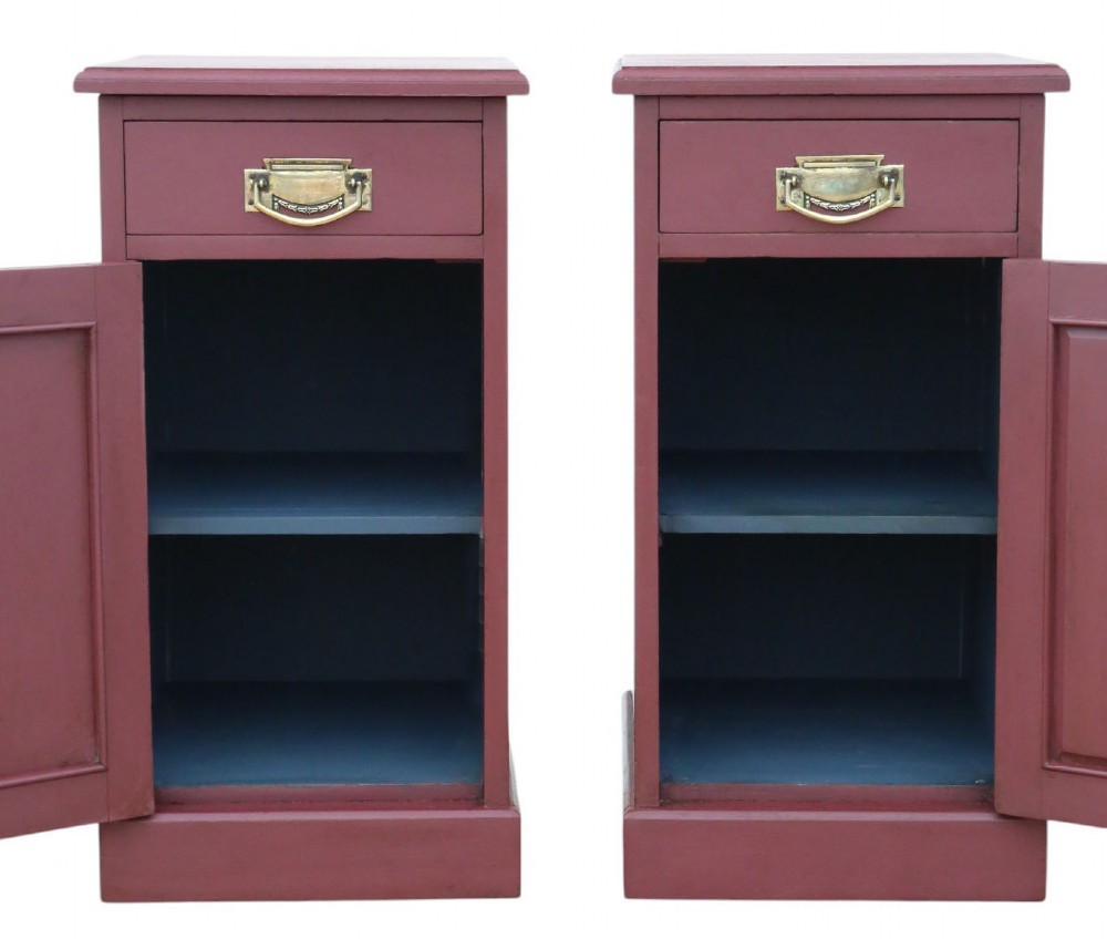 A pair of deep red painted bedside cupboards featuring top drawers with brass handles and panelled single-door cabinets below. View IV