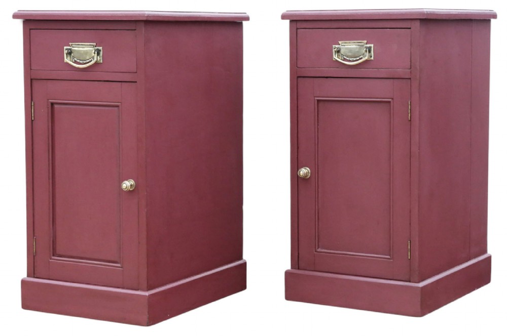 A pair of deep red painted bedside cupboards featuring top drawers with brass handles and panelled single-door cabinets below. View VI