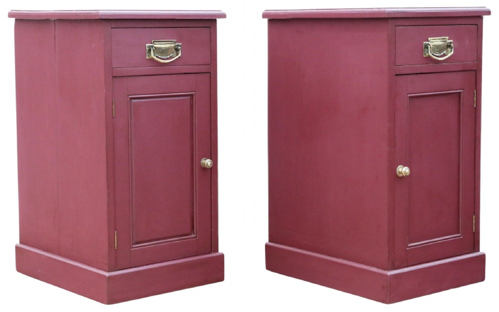 A pair of deep red painted bedside cupboards featuring top drawers with brass handles and panelled single-door cabinets below. View VII