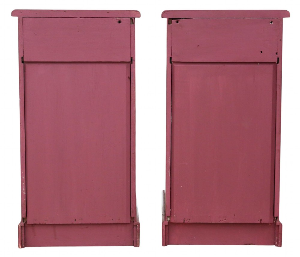 A pair of deep red painted bedside cupboards featuring top drawers with brass handles and panelled single-door cabinets below. View VIII