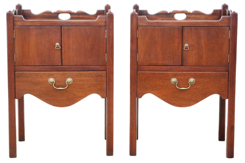 A matching pair of warm brown mahogany bedside cupboards with tray tops, double door compartments, lower drawers, and brass handles. View III