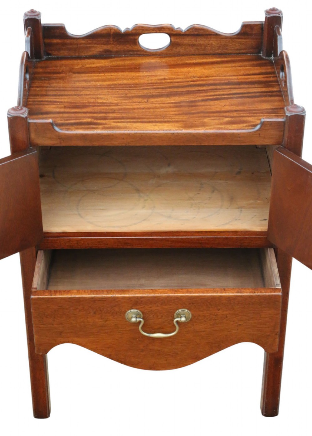 A matching pair of warm brown mahogany bedside cupboards with tray tops, double door compartments, lower drawers, and brass handles. View IV