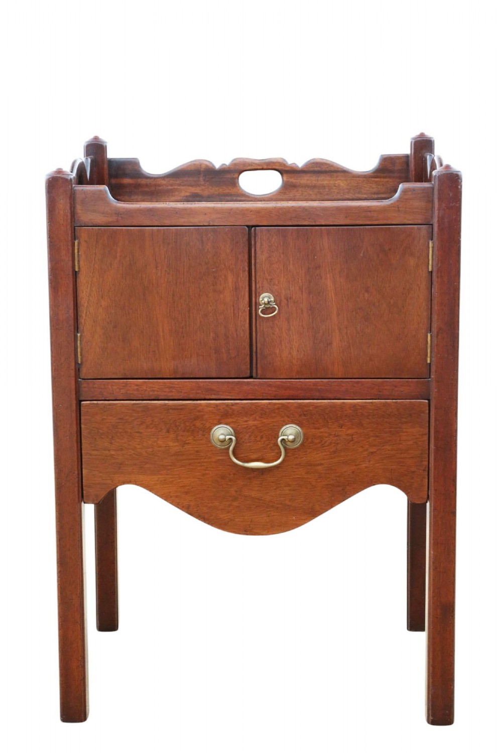 A matching pair of warm brown mahogany bedside cupboards with tray tops, double door compartments, lower drawers, and brass handles. View X