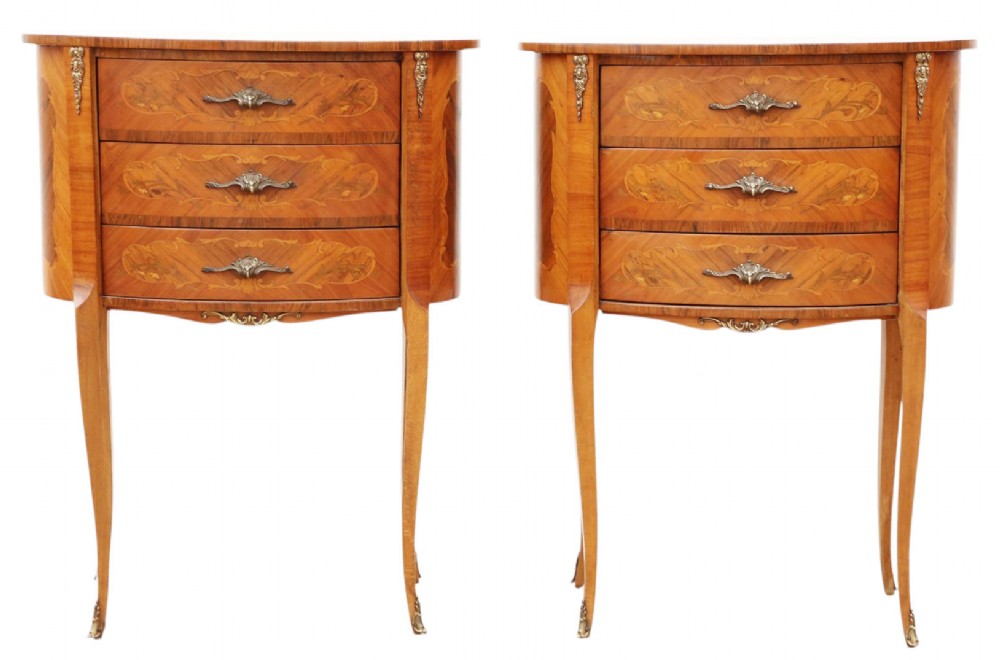 A pair of French oval bedside tables with floral marquetry inlay, three drawers, gilt mounts, and slender cabriole legs. View II
