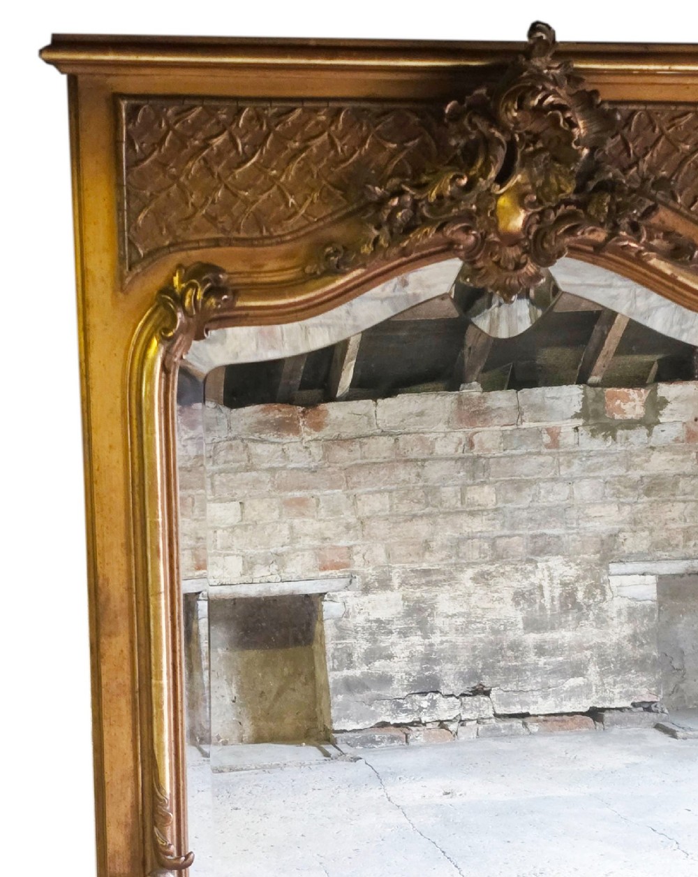 A tall 19th-century gilded overmantel mirror featuring an arched frame, top cresting, and molded lattice frieze. View II
