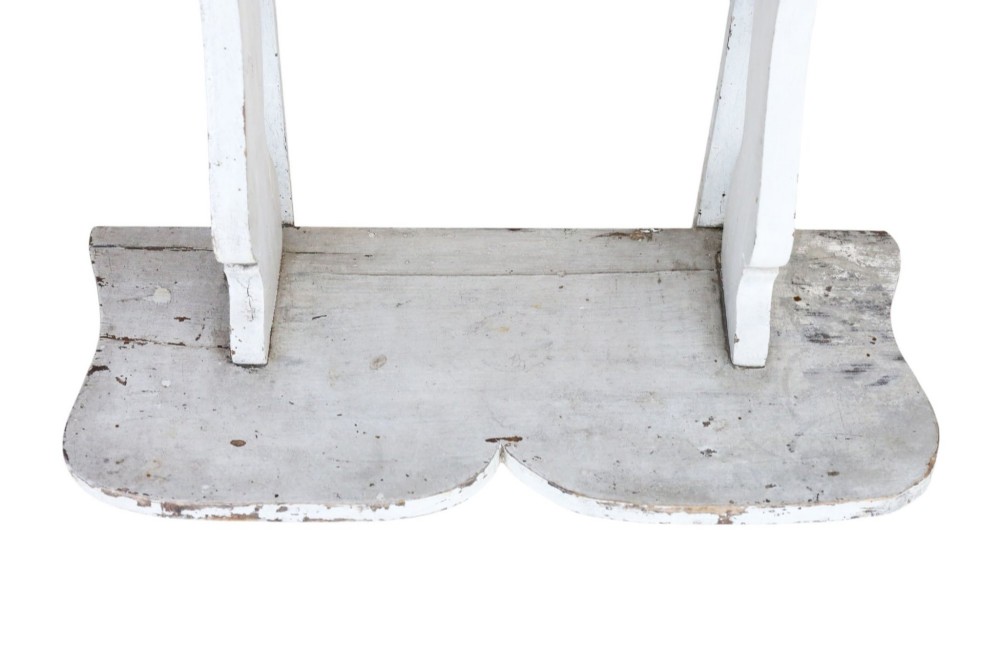 A pair of 19th-century wall-mounted wooden shelves featuring five tiers with shaped, curved upright supports in a distressed white painted finish. View III