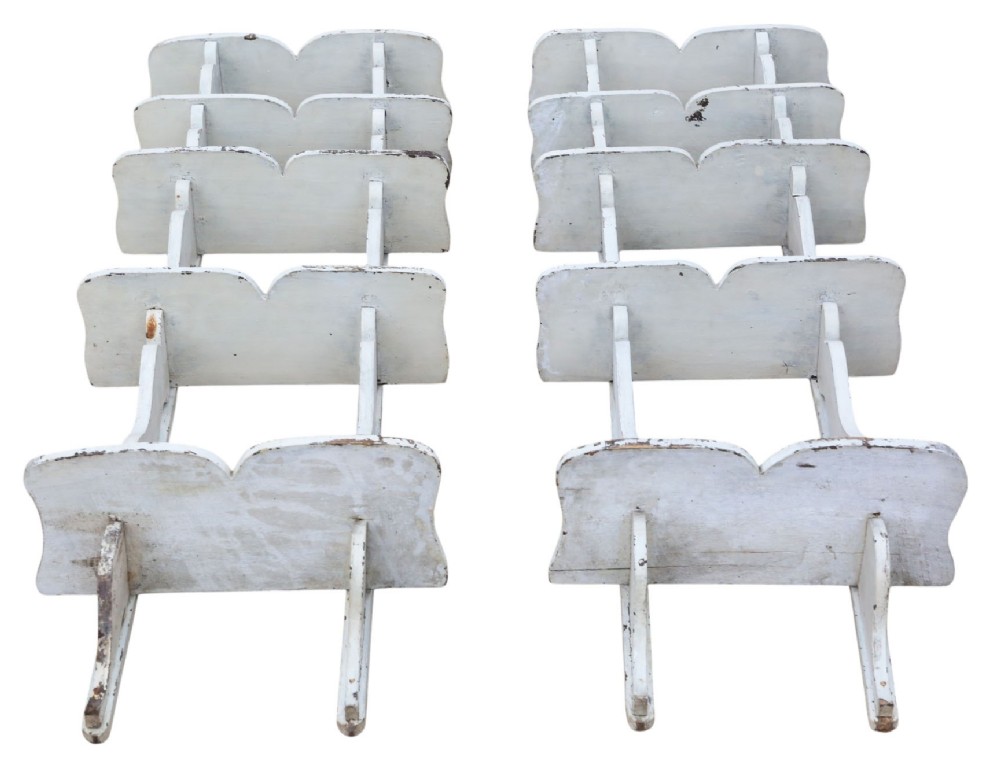 A pair of 19th-century wall-mounted wooden shelves featuring five tiers with shaped, curved upright supports in a distressed white painted finish. View VI