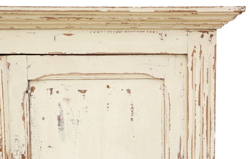 A 19th-century two-tier wooden storage cupboard painted in distressed cream, featuring fluted side details, upper and lower double doors with fielded panels, and two central drawers. View VI