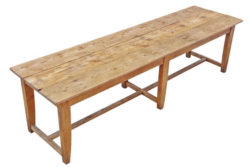 A long 19th-century pine refectory dining table featuring a three-plank top, six tapered square legs, and an H-stretcher base. View II