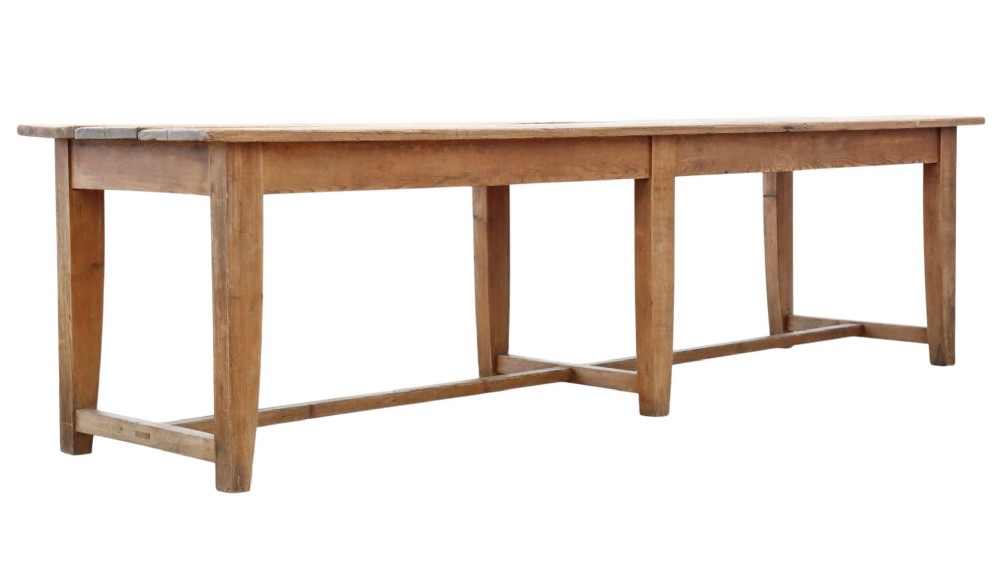A long 19th-century pine refectory dining table featuring a three-plank top, six tapered square legs, and an H-stretcher base. View III