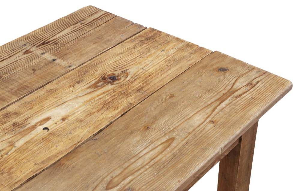 A long 19th-century pine refectory dining table featuring a three-plank top, six tapered square legs, and an H-stretcher base. View V