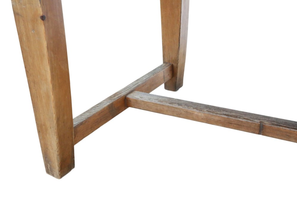 A long 19th-century pine refectory dining table featuring a three-plank top, six tapered square legs, and an H-stretcher base. View IX