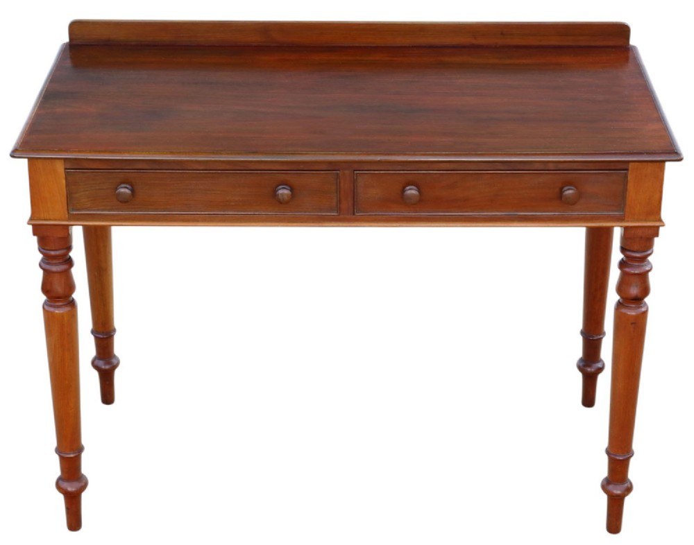 A 19th-century mahogany writing and dressing table featuring two frieze drawers with turned handles, a low gallery back, and tapered turned legs. View II