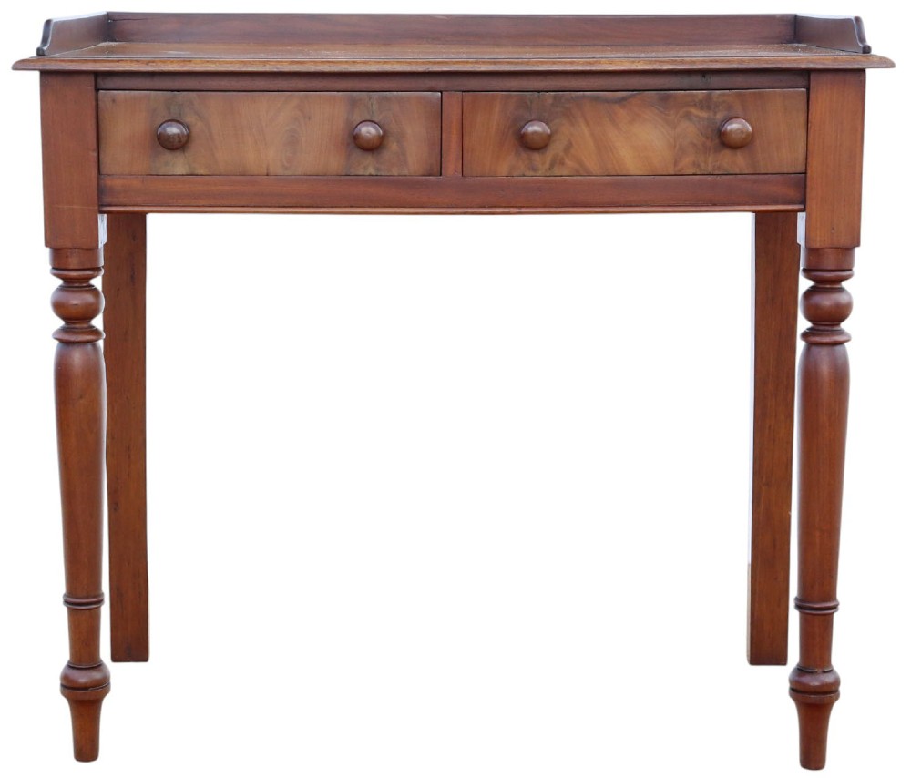 A 19th-century mahogany writing table featuring a gallery top, two frieze drawers with wooden knob handles, and turned legs. View III