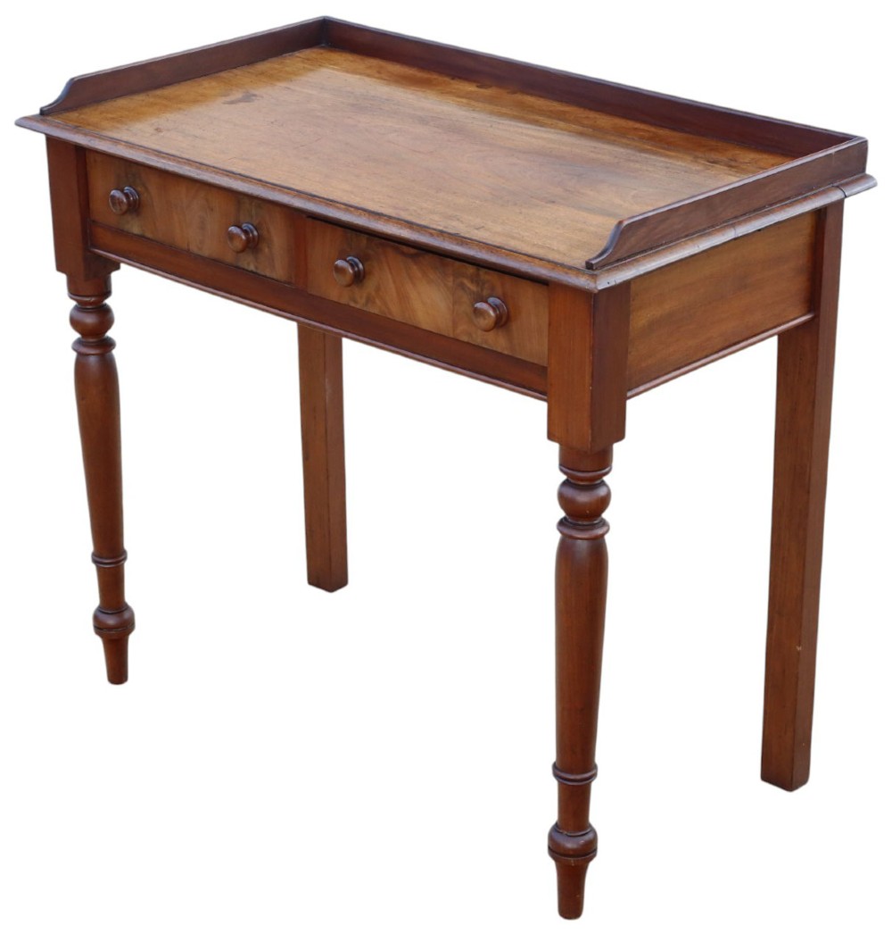 A 19th-century mahogany writing table featuring a gallery top, two frieze drawers with wooden knob handles, and turned legs. View IV